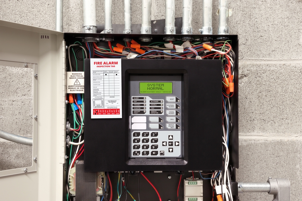 Fire,alarm,control,panel,in,service,room,with,fire,inspection
