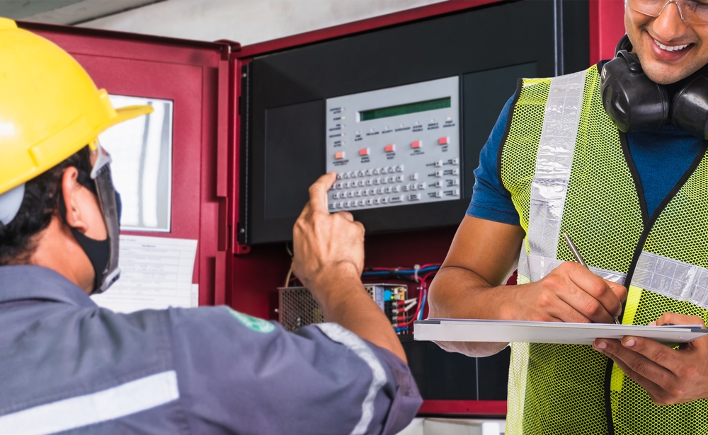 Technician,checking,doing,work,maintenance,fire,alarm,system,in,a